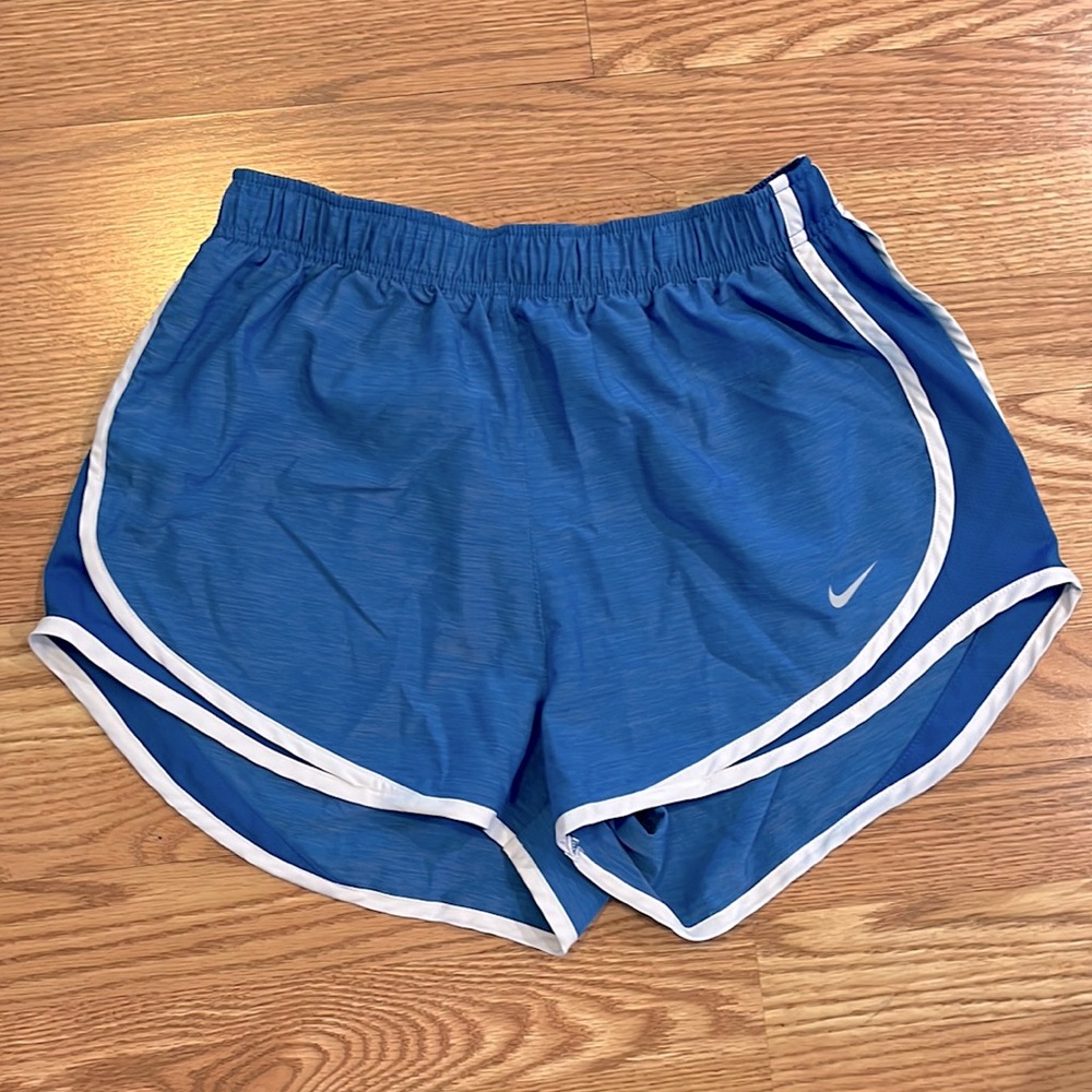 Light blue and white Nike running shorts
